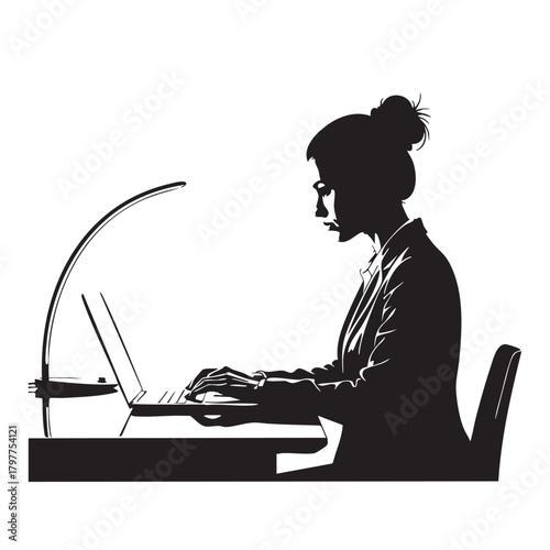 Silhouette of focused businesswoman working on laptop at desk with modern lamp, capturing professional dedication and productivity in an office environment