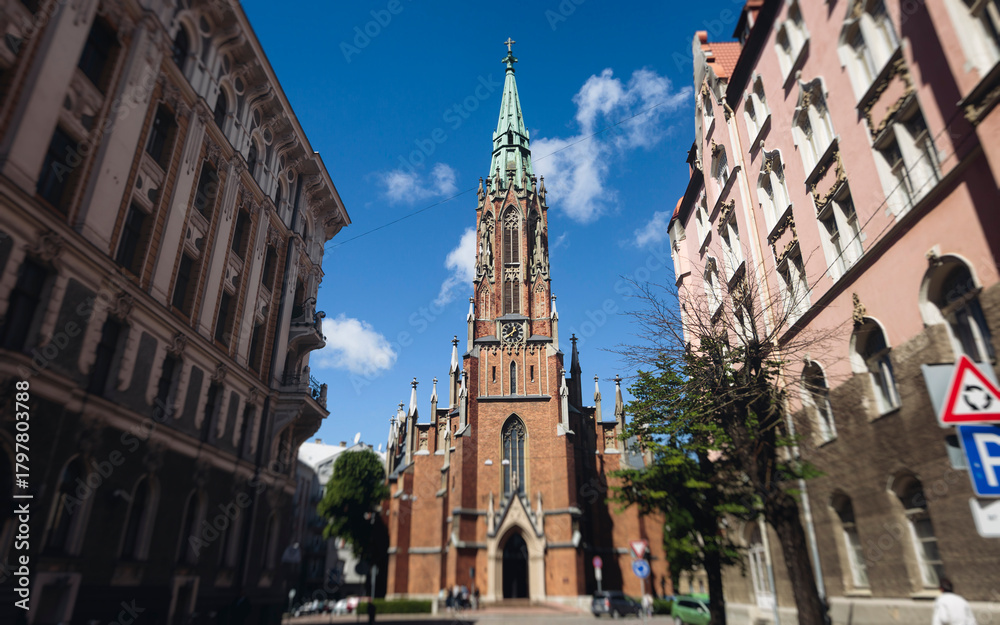 Fototapeta premium Riga Old Town view, Latvia, streets of Vecriga historical center with Town Hall square, House Of The Black Heads, Cathedral and church, travel to Latvia and Baltic States, summer day with a blue sky