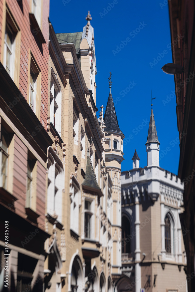 Fototapeta premium Riga Old Town view, Latvia, streets of Vecriga historical center with Town Hall square, House Of The Black Heads, Cathedral and church, travel to Latvia and Baltic States, summer day with a blue sky