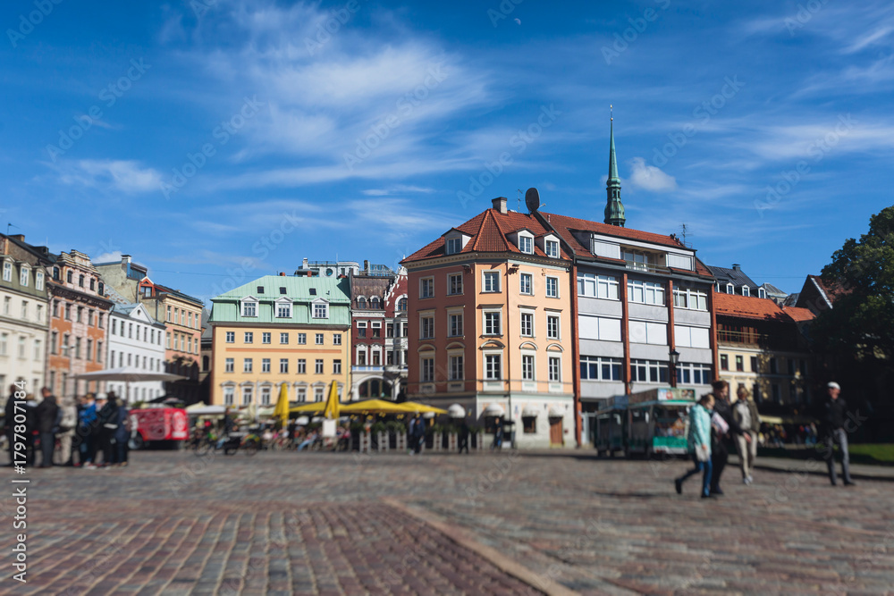 Obraz premium Riga Old Town view, Latvia, streets of Vecriga historical center with Town Hall square, House Of The Black Heads, Cathedral and church, travel to Latvia and Baltic States, summer day with a blue sky