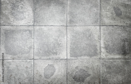 texture of gray, large square concrete tiles with damage