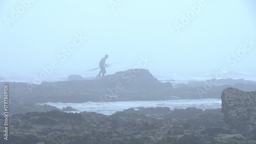 Aveiro, Portugal. = October, 4, 2024. Fisherman Searching for Bait on Foggy Portuguese Coast-2254