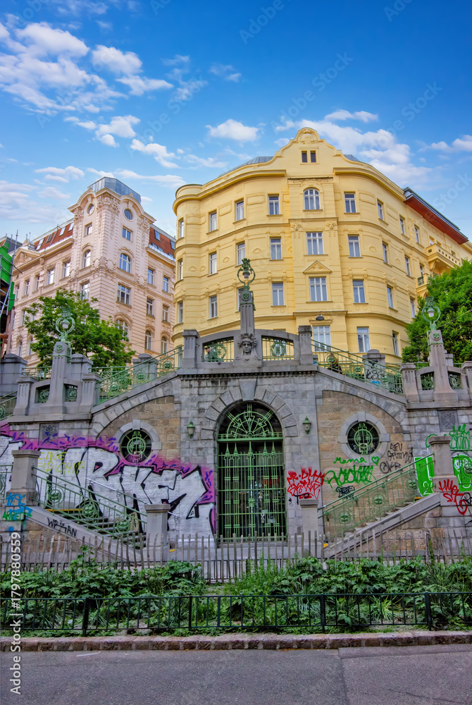 Fototapeta premium a historic stone staircase and archway covered in colorful graffiti
