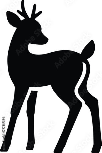 Black silhouette of a young deer, stag or fawn with small antlers.