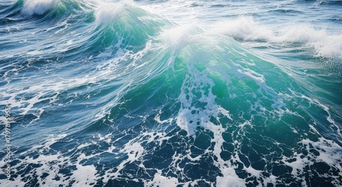 Fototapeta Naklejka Na Ścianę i Meble -  Dynamic ocean wave with turquoise and deep blue hues, captured in motion with foamy white crests and turbulent water, conveying power and the vastness of the sea