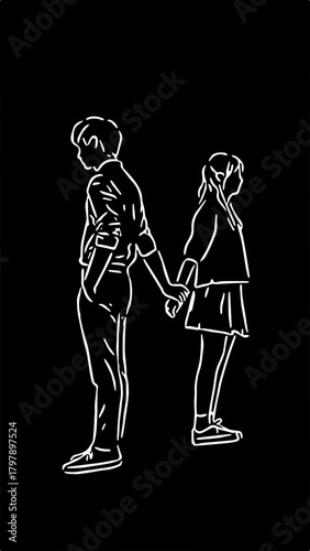 Couple of teenagers in love on a date stand holding hands