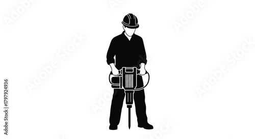 Silhouette of a construction worker operating a jackhammer tool