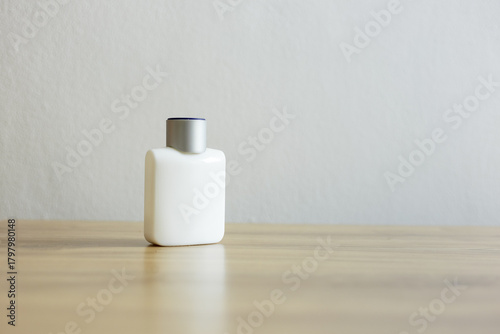 White cosmetic bottle on neutral background