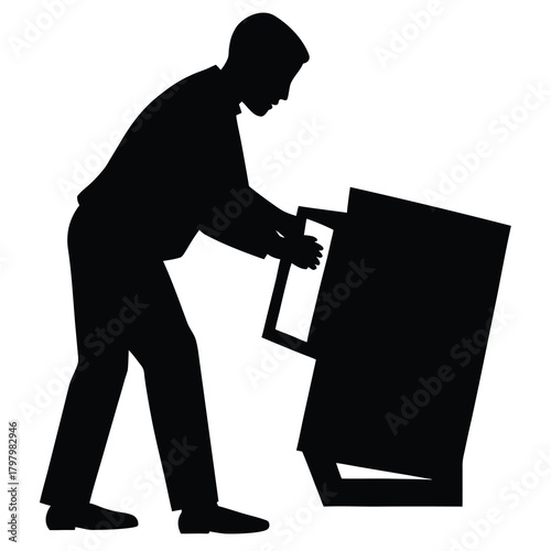Silhouette of man moving and setting up arcade machine for video game playing