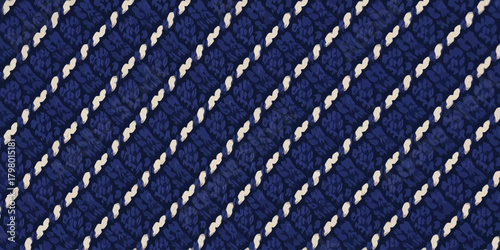 A dark blue fabric with a textured pattern and diagonal white lines running across the surface area