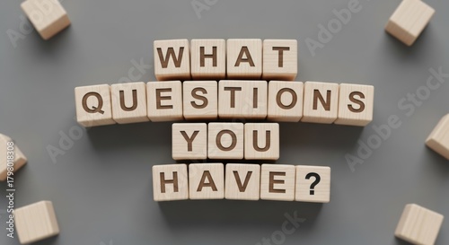 Inquisitive Mind: A mosaic of wooden blocks spells out the thought-provoking question What questions you have? against a neutral backdrop, inviting dialogue and sparking curiosity.