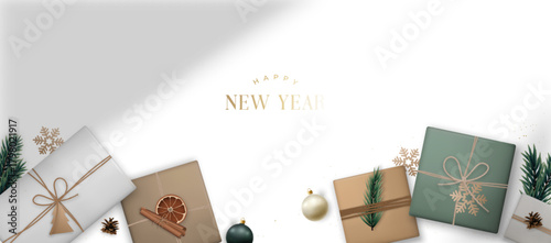 Elegant arrangement of gift boxes, adorned with festive decorations, evokes holiday cheer