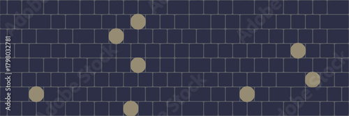 A dark blue brick wall background with several scattered light yellow circles across the surface of the wall