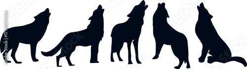 Silhouette of a pack of wolves howling at the moon