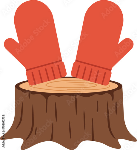 Red mittens placed on wooden stump in winter season  