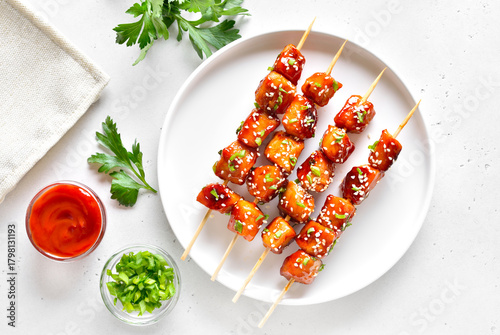 Teriyaki chicken skewers on plate