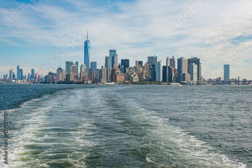 Woman watching skyline from ferry