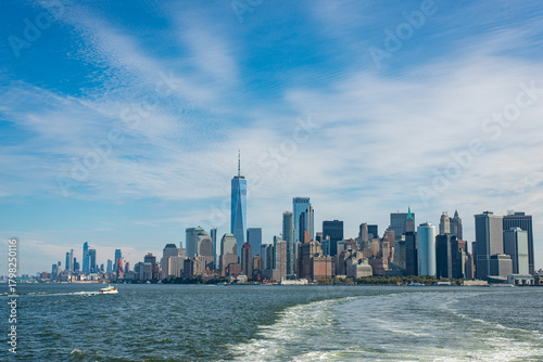 Manhattan skyline with ferry wake