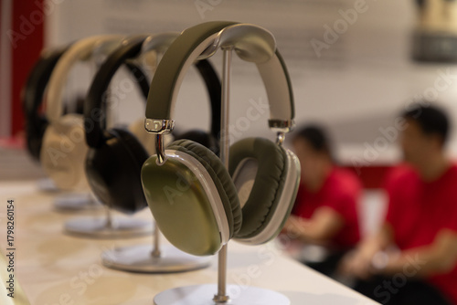 Stylish headphones displayed on stands in modern retail environment