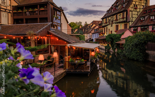 Fotografie Half timbered houses by canals of Little Venice in Colmar, France at sunset