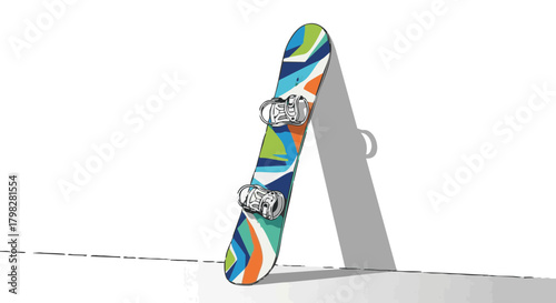 Snowboard leaning against wall with colorful geometric design  