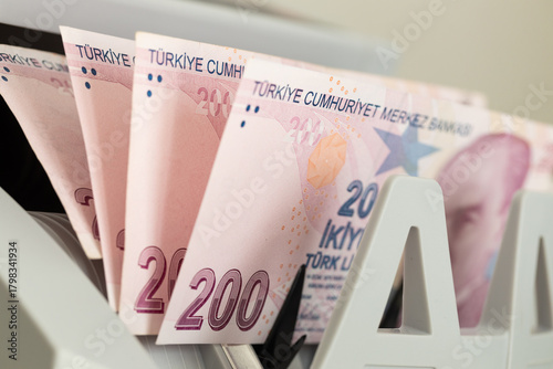 Fototapeta Naklejka Na Ścianę i Meble -  Turkish lira in a bill counter. Financial concept. Turkiye money. Business background. Close up