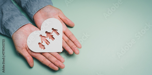 Hands presenting heart family cutout, emotional connection awareness, mental stability support, family protection insight, wellbeing improvement, caring relationship support concept