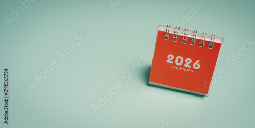 Red 2026 calendar on desk, time planning awareness, productivity improvement, mental clarity support, schedule management insight, organized lifestyle preparation concept