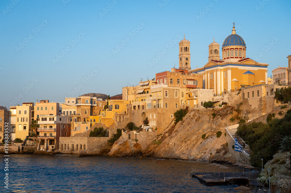 Fototapeta premium Venetian architecture of Ermoupoli and the dome and bell towers of Saint Nicholas church on the Greek island of Syros