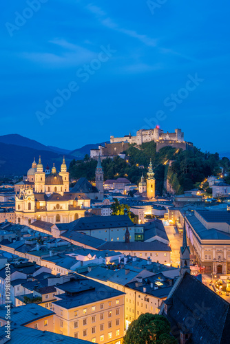 Illuminated Salzburg Old Town and Hohensalzburg Fortress at Evening Twilight. Austria. Blue Hour. Wide Shot
