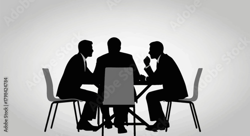 Silhouetted men in suits gathered around a table in a meeting