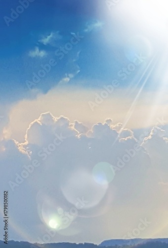 Blue Cloud Sky with sunbeams and light spots above the Blue Ridge Mountains