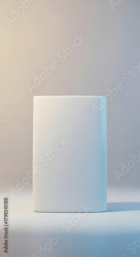 A minimalist white ceramic vase with a smooth surface and simple rectangular shape placed on a flat surface against a neutral background