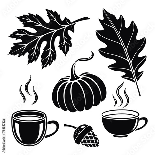 Autumn harvest elements including oak leaves, pumpkin, acorn and steaming hot drinks