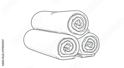 A stack of three white rolled up towels arranged in a triangular pyramid formation for spa or home use.