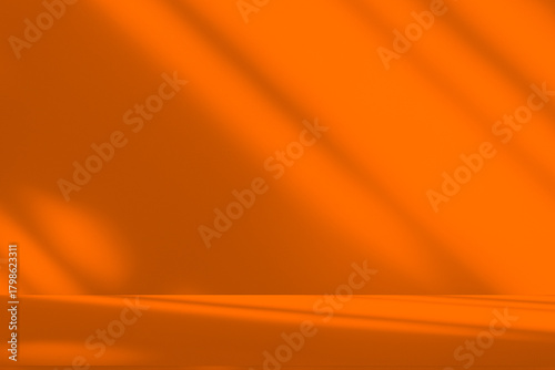 Wall interior background, studio and backdrops show products.with shadow from window color orange background for text insertion and presentation product	