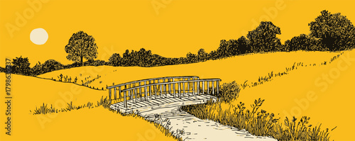 A yellow bridge spans a field with trees in the background. The sun is setting in the distance