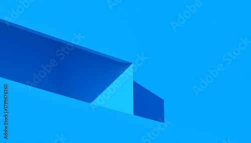 Abstract composition of blue geometric shapes creating a minimalist and modern design with strong lines and shadows.