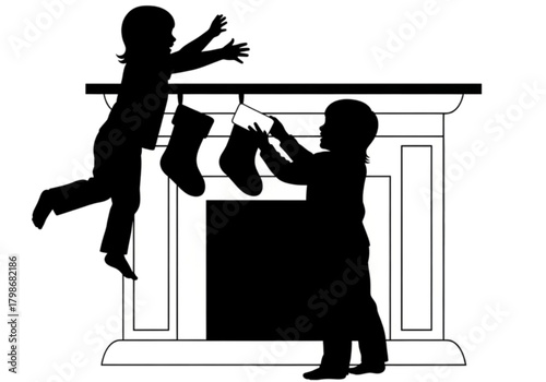Silhouette of two children hanging Christmas stockings on a fireplace.
