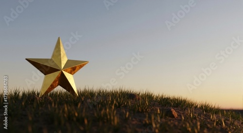 Fototapeta Naklejka Na Ścianę i Meble -  Golden star on grassy hill at sunset — symbol of success and excellence, award concept, copy space available