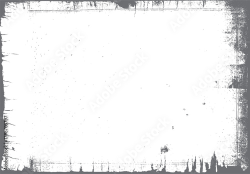Grungy distressed textured border frame with rough edges and scattered speckles on white background grunge