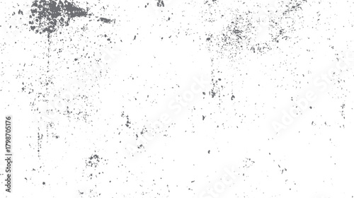 White background with scattered irregular dark gray speckles and splotches creating a grunge texture effect