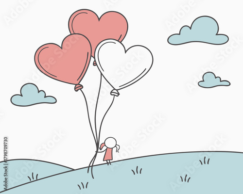 Girl holding heart balloons in a field