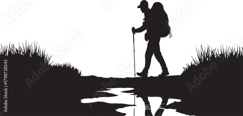 Silhouette of a hiker with backpack and trekking poles crossing a stream walking