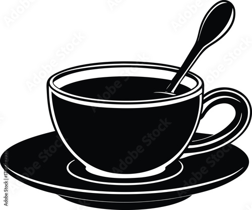 a small espresso cup with a metal spoon on a sauc.eps