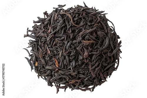 Pile of dark, dried, crinkled tea leaves on black backdrop