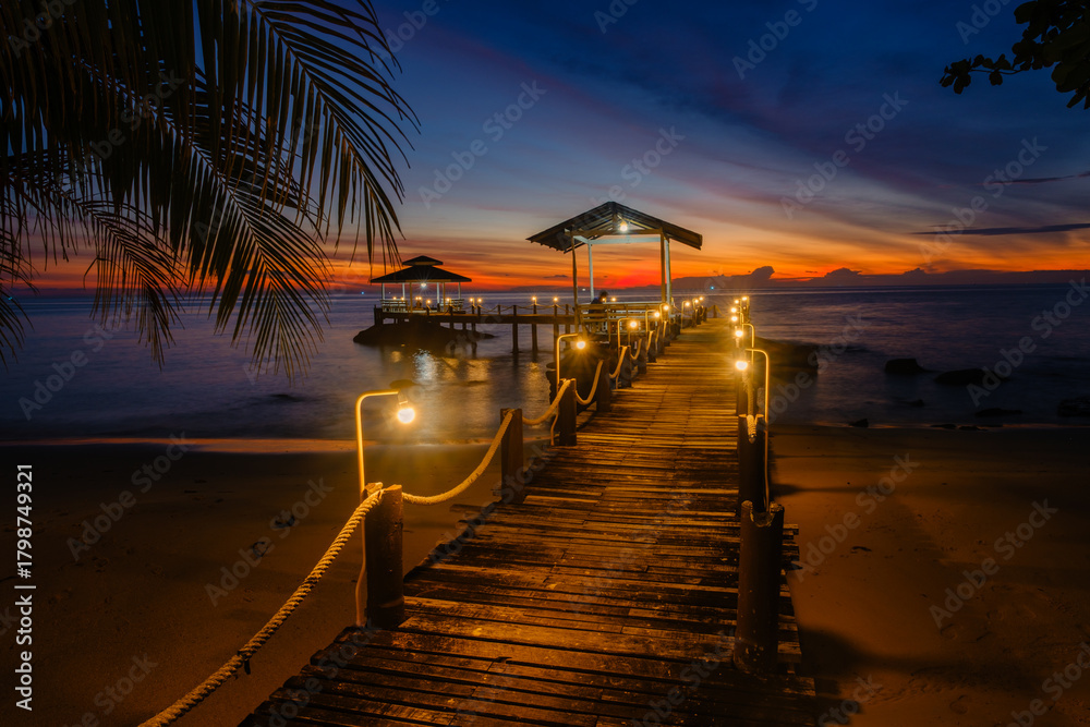 Fototapeta premium Breathtaking sunset view from a pier on Koh Kood Island, Thailand