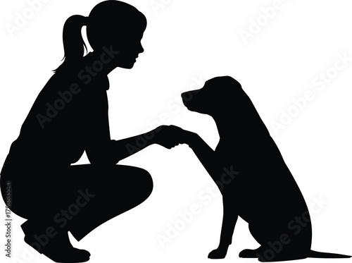 Silhouette of woman training dog while kneeling and holding paw, showing pet obedience companionship relationship in simple black vector illustration on white background