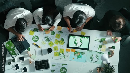Top view of executive manager hold tablet display clean energy at meeting. Aerial view of business people working together to plan and invest in sustainable environmental investment. Alimentation.