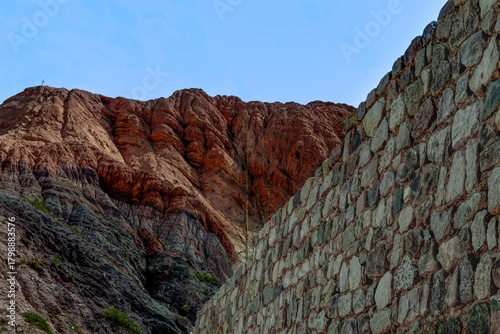 Stone Wall and Colored Hills in Purmamarca, Argentina